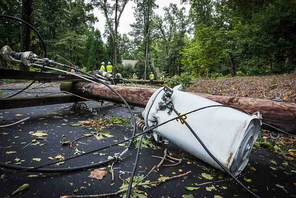 Power-Line-Down-1000 Woman Holding Candle During Power Outage
